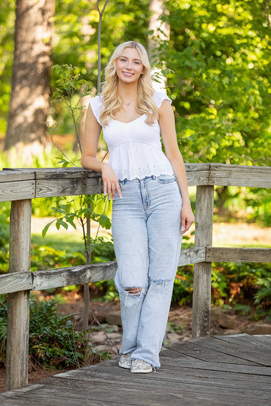 Houston Senior Photographer: Beautiful Magazine Style Senior Portraits By Atascocita Photography 3 Houston Senior Portrait Girl in white top and light wash jeans at Mercer Botanic Gardens in Humble.